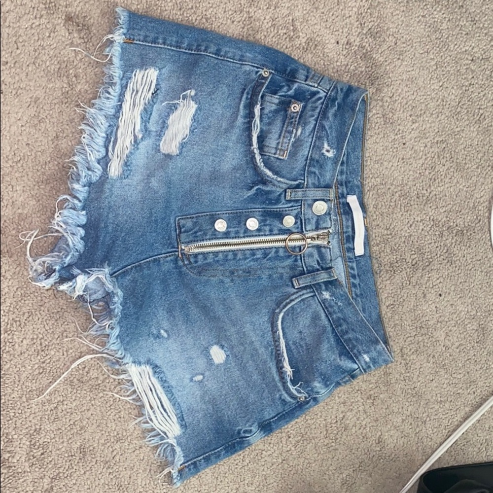 Denim distressed jean shorts with unique zipper